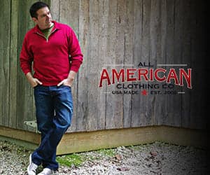 Close-up of a quarter-zip pullover showing its fabric, neck tag, and zipper, from All American Clothing Co. promotional imagery.